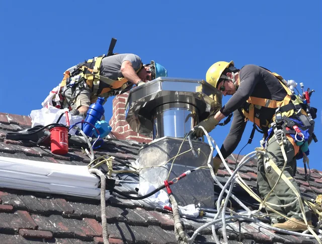 Protective chimney cap installed by Whitman Chimney Sweep in Whitman, MA